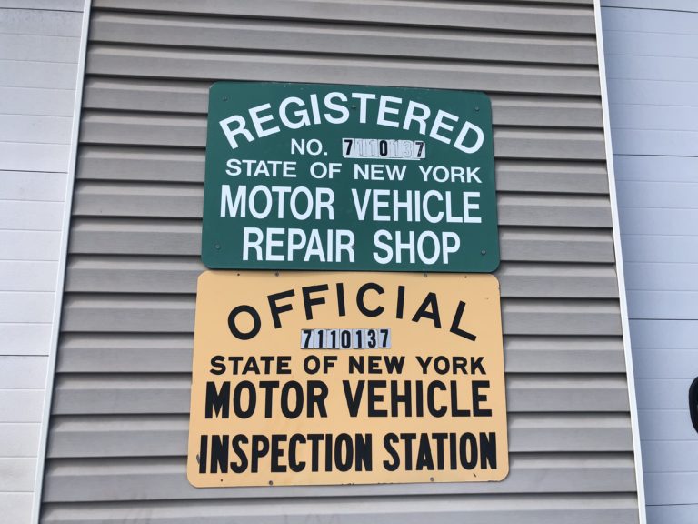 New York motor vehicle repair and inspection station signs at the shop